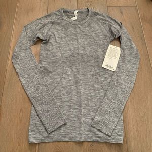 NWT Grey/ Silver Swiftly tech long sleeve size 6